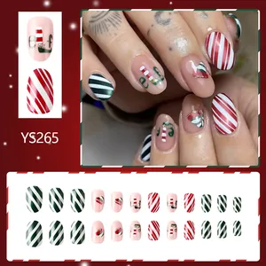 Faux ongles courts ovales Noël elfe avec rayures rouges vertes et fini pailleté