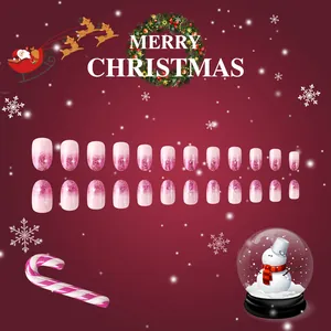 Short oval Christmas press-on nails featuring pink gradient, glitter, and snowflakes