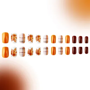 Short square glossy press-on nails with maple leaf patterns and plaid in autumn colors
