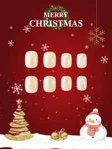 Macro detail of pearlescent champagne press-on nails with white snowflake Christmas patterns