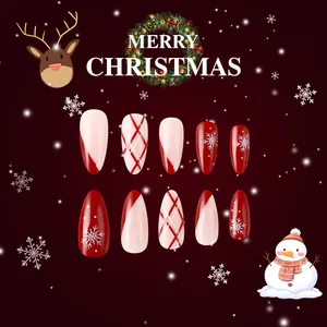 Detail of glossy Christmas press-on nails featuring red plaid and white snowflake patterns