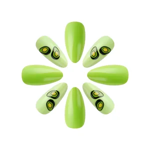 Glossy avocado green almond press-on nails with abstract print patterns on white background
