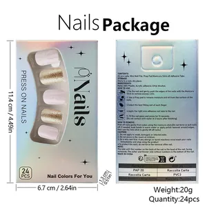Detailed set of Christmas press-on nails featuring pink snowflakes and gold glitter accents