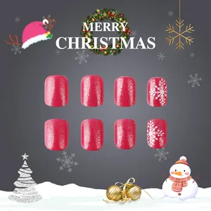 Short square press-on nails with pink glitter, white snowflakes and Christmas motifs