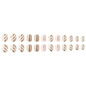 Detail of 24pcs gold glitter Christmas press-on nails with snowflakes and stripes pattern
