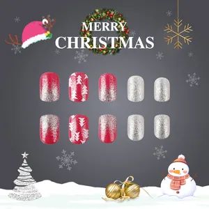 Short square Christmas press-on nails with red glitter snowflake and silver sparkle