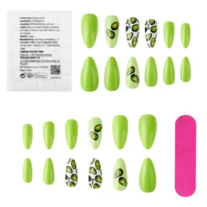 Detail of short avocado green press-on nails with almond shape and adhesive stickers