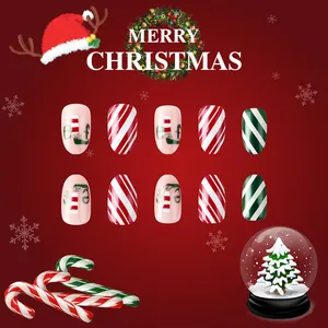 Faux ongles de Noël courts ovales avec rayures rouges vertes et motifs elfes brillants
