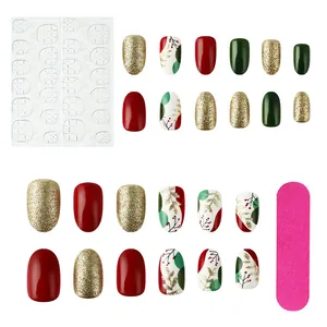 Detailed set of Christmas press-on nails with holly leaves, red glitter and gloss finish