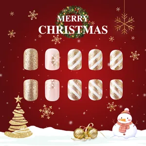 Short glitter Christmas press-on nails with gold snowflake and stripe patterns
