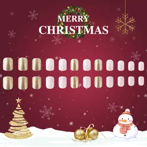 Short glossy Christmas press-on nails with red ribbons, snowflakes and gold glitter
