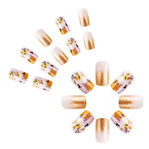 Short glossy autumn pumpkin and maple leaf press-on nails with gold glitter for Thanksgiving