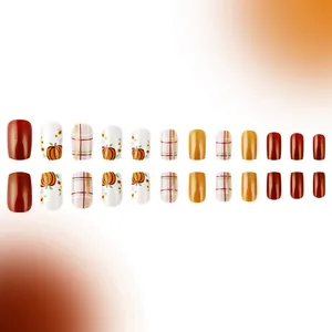 Detail view of 24pcs autumn press-on nails with pumpkin, sunflower and plaid patterns
