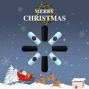 Detail of Christmas press-on nails with blue snowflake patterns and matte black finish