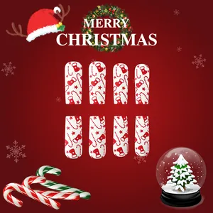Lange glänzende Weihnachts-Nägel zum Aufkleben mit rot-weißen Zuckerstangen und Sternen