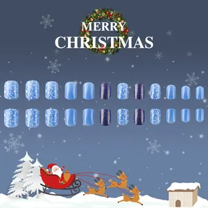 Short square Christmas press-on nails with blue snowflake patterns and glitter detail