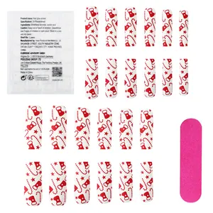Lange glänzende Weihnachts-Nägel zum Aufkleben mit rot-weißen Zuckerstangen-Motiven