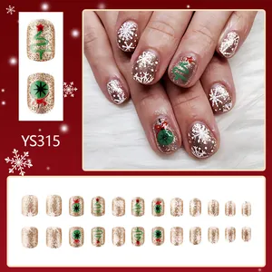 Faux ongles carrés courts de Noël dorés avec motifs flocons de neige et sapins
