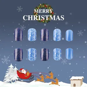 Blue Christmas press-on nails with snowflakes and glitter in short square shape
