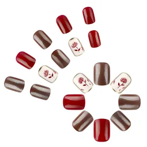 Short glossy square press-on nails set in red, cat-eye brown, and rose floral patterns