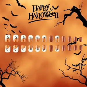 Detail of 24pcs Halloween press-on nails featuring pumpkin patterns and orange glitter finish