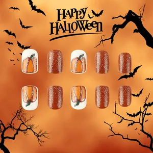 Short round Halloween press-on nails set featuring orange pumpkins and silver glitter