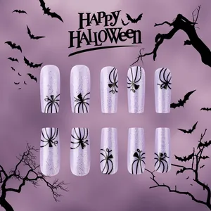 Faux ongles violets brillants pour Halloween avec motifs d'araignées et citrouilles