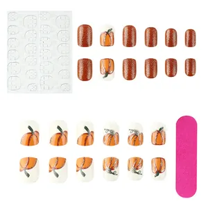 Detail of Halloween pumpkin nail set with 24 false nails, jelly glue, and mini file kit