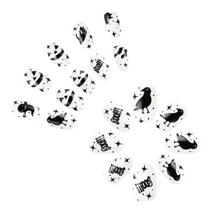 Halloween press-on nails set with black and white spider web ghost and pumpkin designs