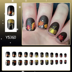 Short glossy autumn maple leaf and pumpkin press-on nails with glitter accents