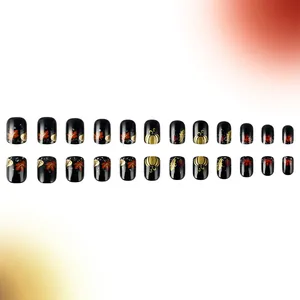 Close-up of autumn maple leaves and pumpkin patterns on glossy black press-on nails