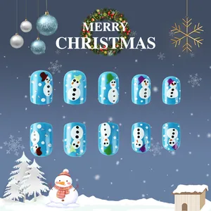 Detail of light blue short Christmas fake nails featuring cute hand-painted snowman patterns