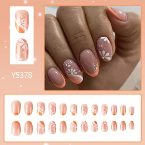 Short french glossy press-on nails with daisy patterns and gold glitter accents