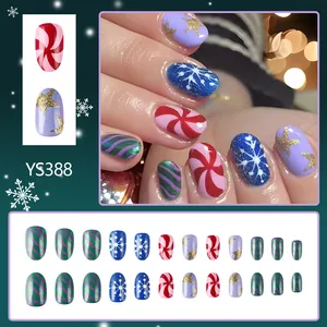 Christmas press-on nails set with red green swirl and snowflake designs, 24pcs short length