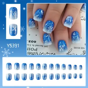 Blue glitter Christmas fake nails set with white snowflake prints and silver shimmering gradient