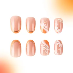 Short oval press-on nails in nude pink and orange with daisy prints and gold glitter