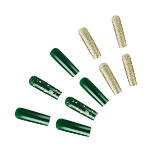 Detail of Christmas press-on nails featuring green tones, gold foil, and glitter finish