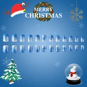 Short square blue gradient fake nails with white snowflakes and festive glitters