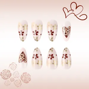 Leopard print heart and flower press-on nails in long pointed shape on pink background