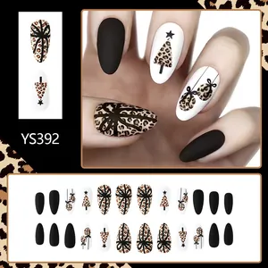 Detail of matte leopard print Christmas nails with holiday trees and gift box patterns