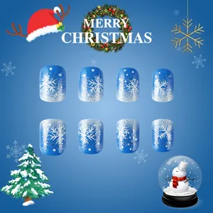 Short square glossy blue fake nails with white snowflakes and silver glitter gradients