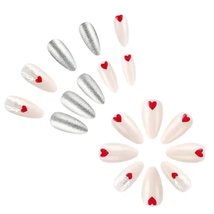 Christmas press-on nail set with silver glitter, red hearts, and reindeer antler designs