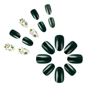 Short glossy Christmas press-on nails set with green glitter and tree patterns