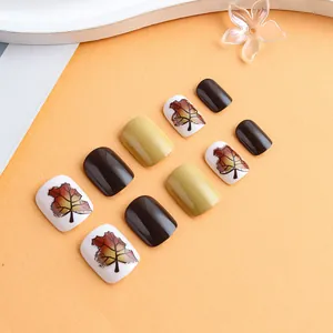 Short square maple leaf press-on nails set with glitter gold accents and glossy finish