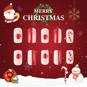 Detailed close-up of glossy short square Christmas press-on nails with Santa and candy motifs