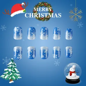 Short square blue gradient press-on nails with silver glitter and snowflake winter patterns