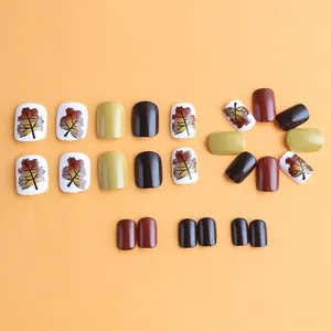 Short square maple leaf press-on nail set in autumn brown, green and glitter gold
