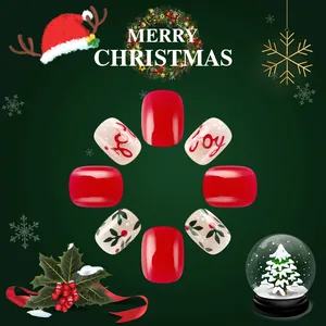 Short round Christmas press-on nails featuring red joy lettering and holly leaf designs