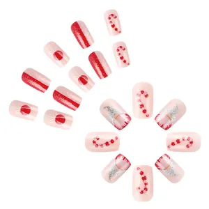 Short square pink Christmas press-on nails with Santa gnome and glitter candy cane designs