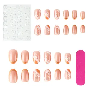 Detail view of french short press-on nails set with floral patterns and manicure tools